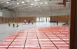 Systém plošného teplovodního vytápění Rehau vytápí sportovní halu v Dolních Břežanech