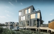 Plovoucím domům u Amsterdamu propůjčily nevšední vzhled fasádní hliníkové plechy